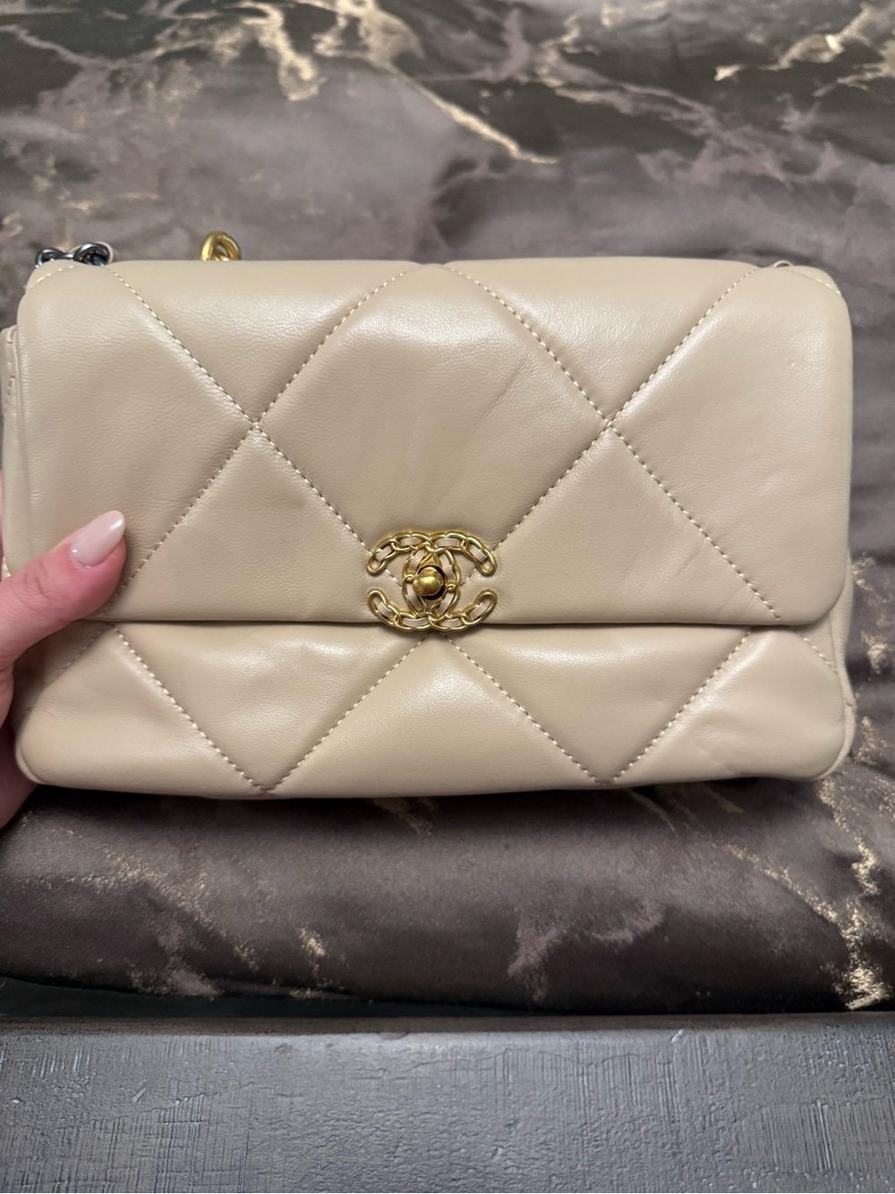 Beige gold accented bag